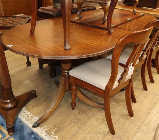 A Regency design twin pillar mahogany dining table 210cm extended (one spare leaf)